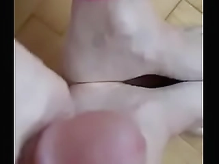 brunette beauty jerks off with glasses on