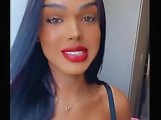 brunette ladyboy with devil's horns rides a fat cock on the sofa